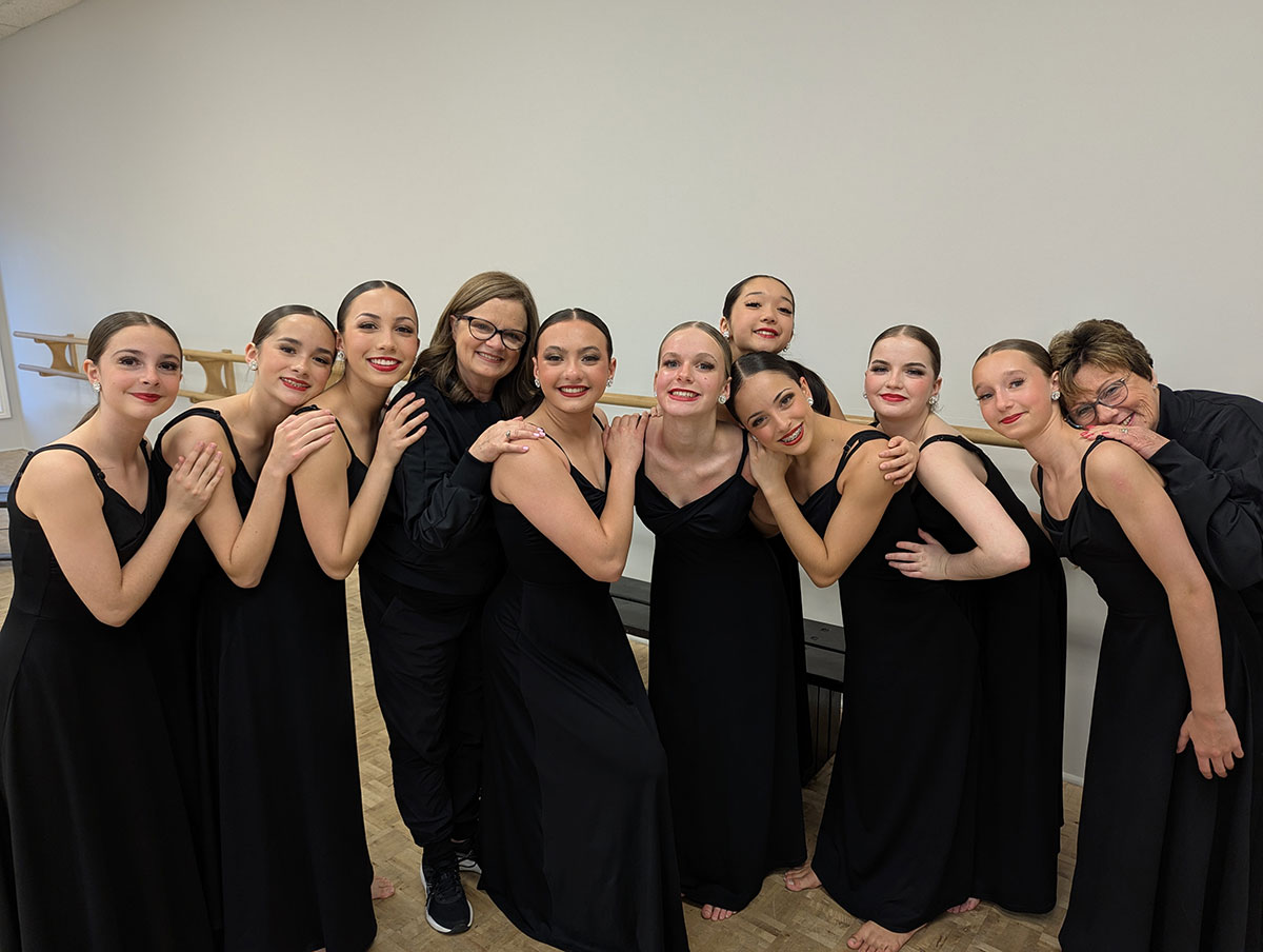 students posing in dance studio
