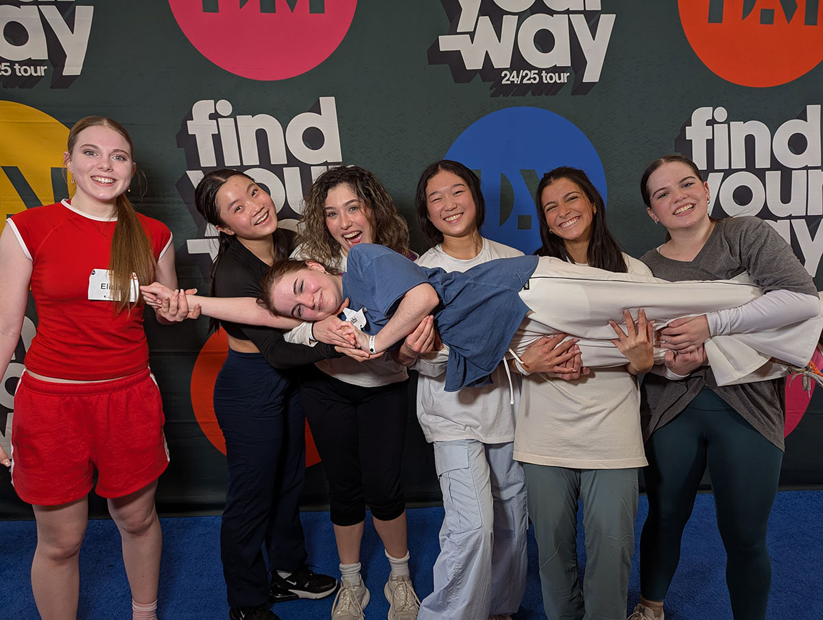 5 girls holding one girl horizontal