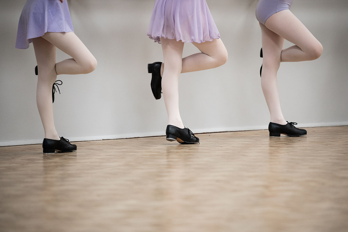 tap shoes on three girls